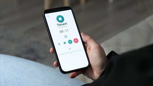 Close-up of a property manager calling a tenant via a professional mobile app. UI features a call timer and maintenance request links. Ideal for real estate services, rental management, and prop-tech