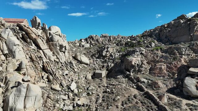 Forward Drone Flight Through Rocky Canyon in Capo Testa, Sardegna
