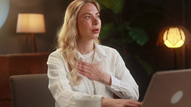 Woman has heart or panic attack. Scared woman shocked about reaction in her body during her work at home alone Mental health problem