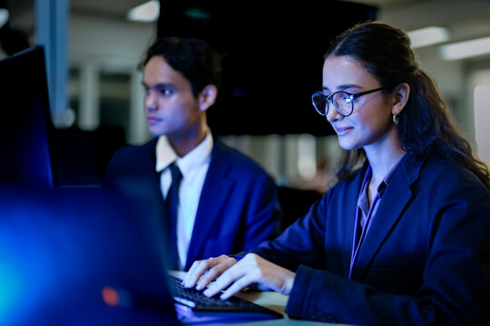 Senior software engineer debugging backend architecture syntax with stylus. DevOps specialists collaborating on cloud infrastructure deployment code.
