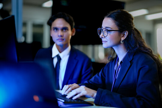 Senior software engineer debugging backend architecture syntax with stylus. DevOps specialists collaborating on cloud infrastructure deployment code.