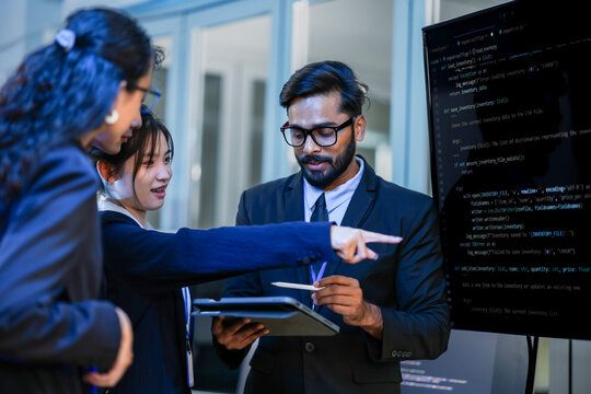 Tech team lead mentoring diverse junior developers on system architecture. Agile scrum master facilitating sprint backlog refinement in modern corporate office.