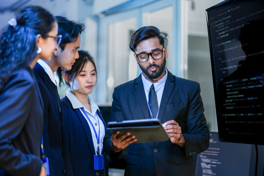 Senior software architect conducting rigorous backend code review with development team. Technical lead analyzing syntax optimization strategies on digital interface.