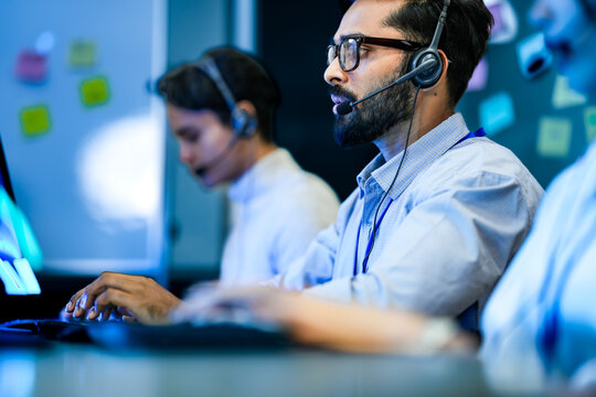 Corporate account manager conducting serious consultative negotiation with enterprise client. Senior sales executive interpreting customer requirement analysis utilizing crm database.