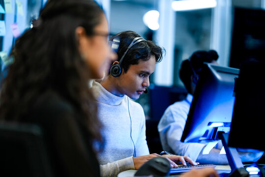 Senior software engineer debugging backend architecture code during agile sprint. Female developer reviewing syntax optimization strategy on digital screen.