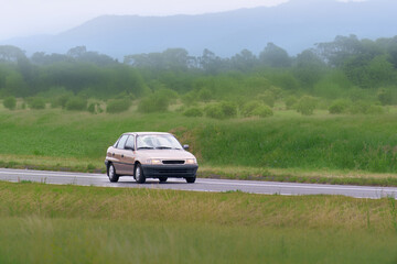 Fototapeta premium Retro vehicle from 90s on open road