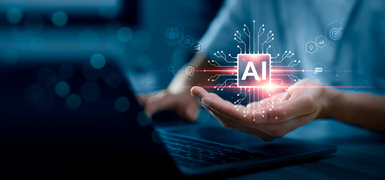 Business professional holding glowing AI microchip icon above laptop keyboard with digital circuit network interface, representing artificial intelligence technology, data processing, and automation