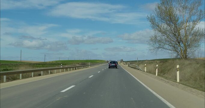 Car POV Driving down the roads of Spain sunny afternoon