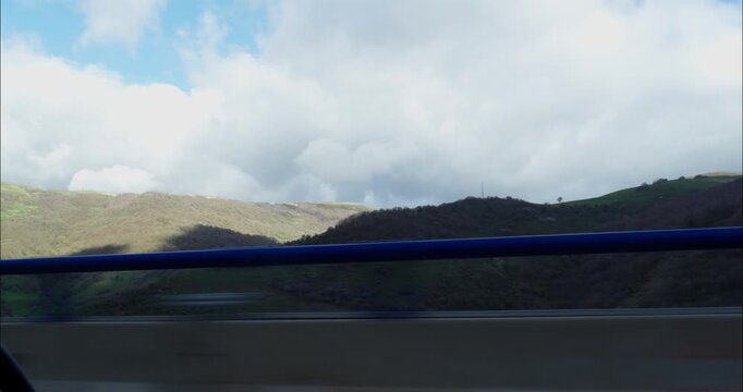 Car POV Driving down the roads of Spain in a cloudy afternoon