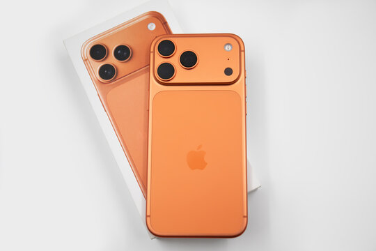 Phone Apple iPhone 17 Pro Max Cosmic Orange unboxing isolated white background with the box