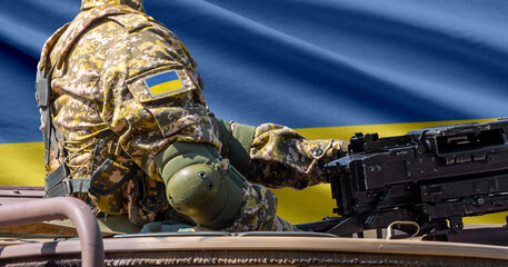 Ukraine flag with soldier at machinegun turret © lucky pics