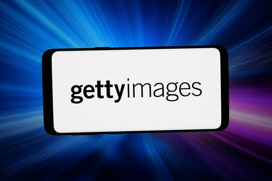 Stuttgart, Germany - 04-02-2026: In this photo illustration, the logo of US company Getty Images Holdings Inc. is displayed on a smartphone in front of abstract background on computer screen.