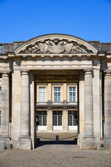 Obraz premium Architectural detail of the sculpted pediment and neoclassical facade of the Palace of Compiegne, a former royal and imperial residence in Picardy, France