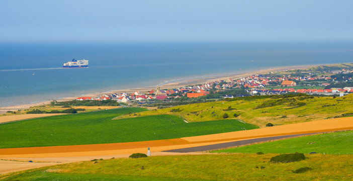 The coastal town of Sangatte and a ferry on the English Channel seen from the heights, France