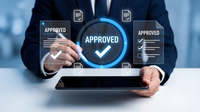 A person uses a stylus to mark an 'APPROVED' status on a glowing digital interface.