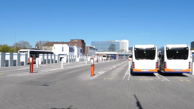 Wiesbaden, Germany - April 8, 2026: Electric public transport buses being charged at a modern bus depot of ESWE in the city center of Wiesbaden, Germany