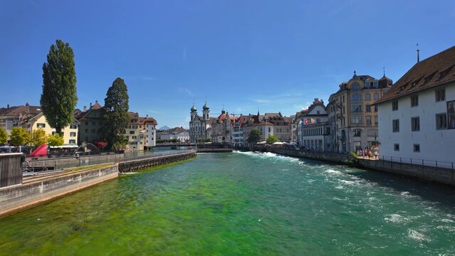 Lucerne riverfront with urban scenic view, highlighting popular Swiss travel destination and beautiful city landscape