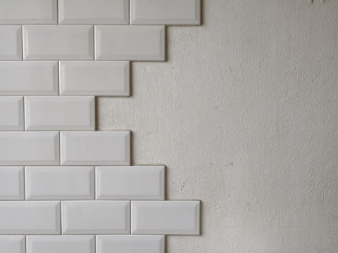 White Ceramic Subway Tiles Wall Installation Home Renovation