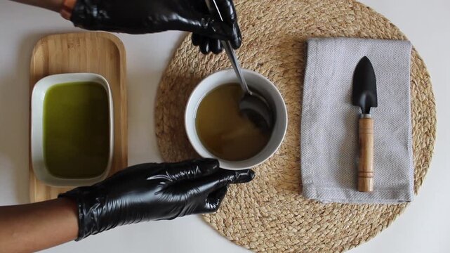 Stirring Melted Shea Butter with Spoon