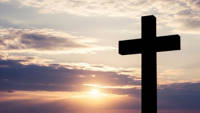 Silhouette of a Christian cross at sunset