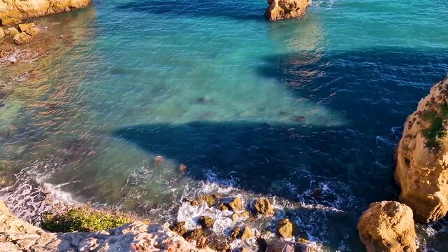 Portugal Algarve 4K Photo of Praia da Marinha Iconic Double Arch in Shape of M with Orange Cliffs and Turquoise Sea Scenic Atlantic Coastline Most Beautiful Beach Travel