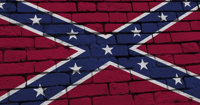 A panning video of a brick wall with the Confederate state flag of the United States of America