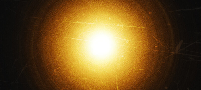 light leak overlay effect background Brilliant white light source emanating outwards with golden yellow halo on dark gritty textured background with scratches