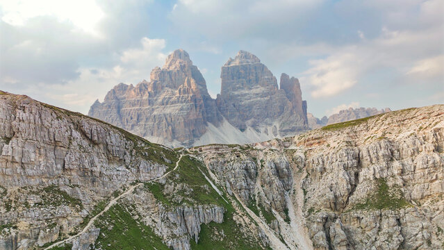 Tre cime di lavaredo peaks rising above trekking path