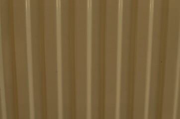 Fototapeta premium Beige vertical metal ridges texture background