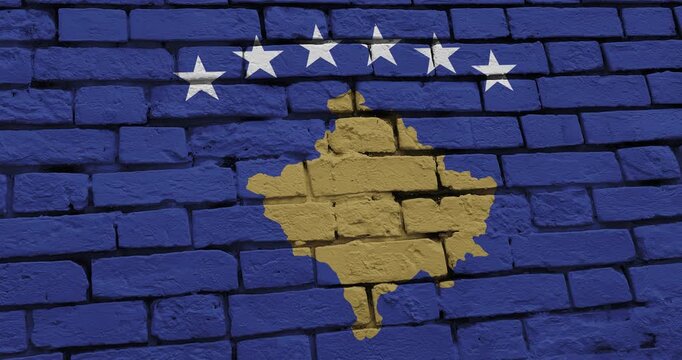 A panning video of a brick wall with the kosovo flag