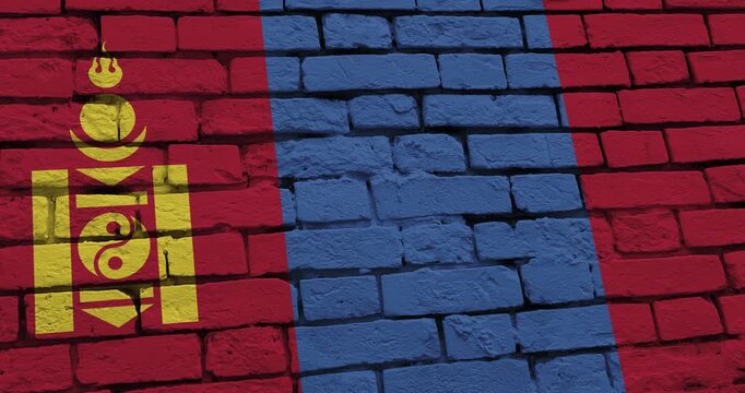 A panning video of a brick wall with the mongolia flag