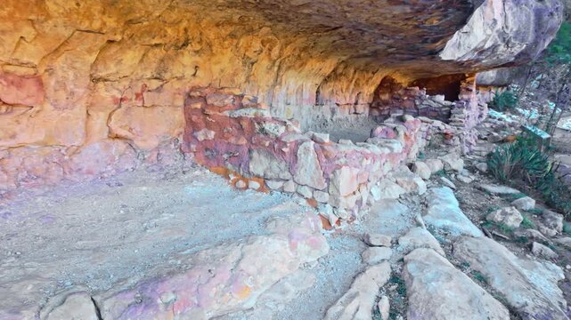 Ancient Sinagua cliff dwellings carved into canyon walls at Walnut Canyon National Monument in Arizona