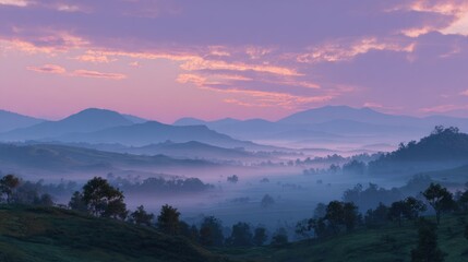 Obraz premium Panoramic view of rolling hills at sunrise with atmospheric perspective and soft colors