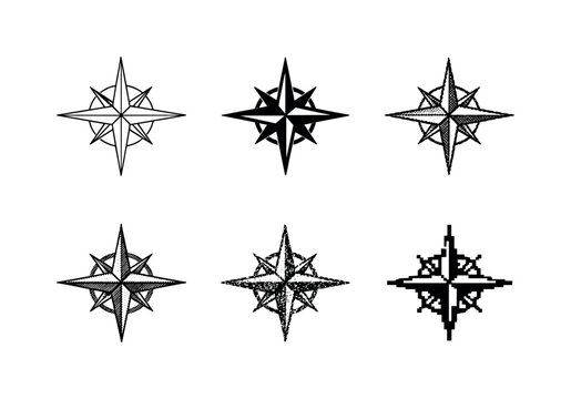 Ornate compass rose with four main cardinal points and diagonal spikes, used to indicate direction and navigation on maps |