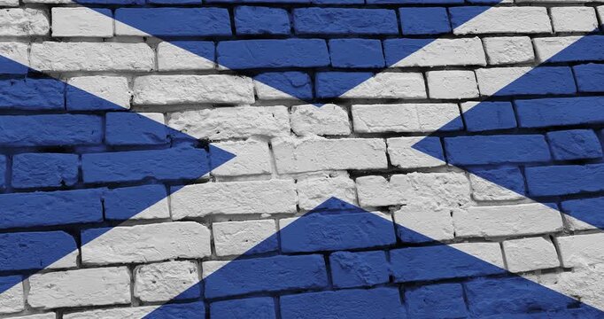 A panning video of a brick wall with the scotland flag