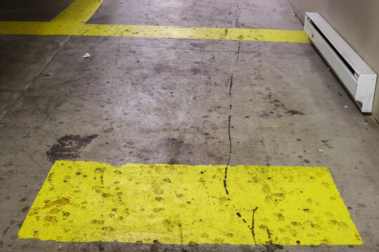 Dirty commercial hallway floor with heavy stains from leaking garbage bags. Unsanitary surface contamination in restaurant building. Cleaning, hygiene and health hazard concept. Selective focus.