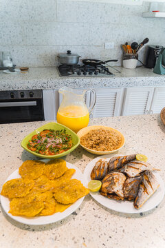 Traditional Caribbean food spread on kitchen counter