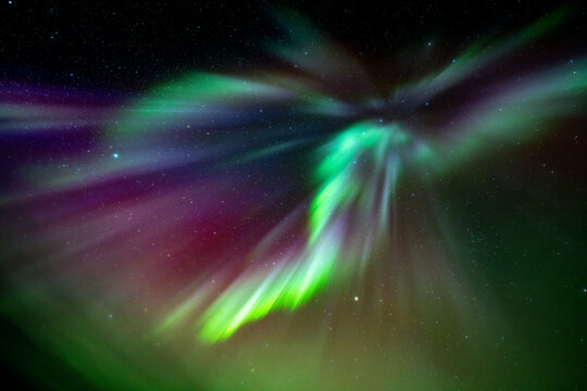 Northern lights aurora over starry sky in Finland night