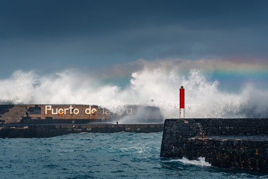 Waves crashing on Tenerife harbor during winter