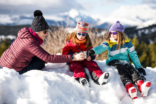 Family enjoying a snowy winter day together