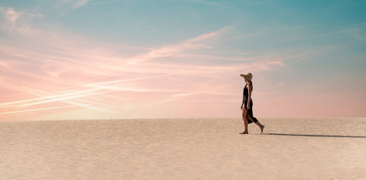 Woman walking on scenic dune in Corralejo, Fuerteventura