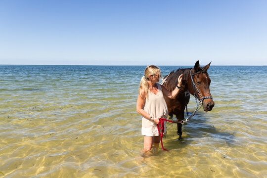  Senior woman, water horses, Vilankulos, Mozambique, Africa