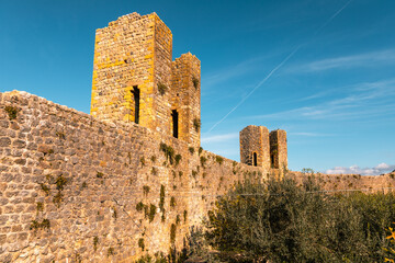 Fototapeta premium Monteriggioni medieval city walls under clear sky, Italy.