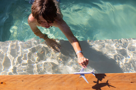 10 year old boy playing in pool, Vilankulos, Mozambique, Africa