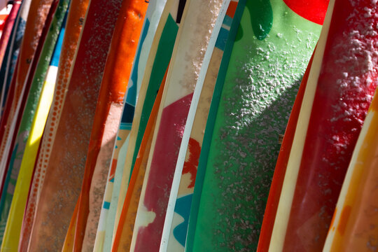 abstract of colorful surf boards stacked up