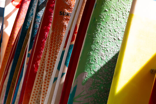 abstract of colorful surf boards stacked up