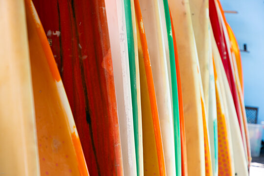 abstract of colorful surf boards stacked up