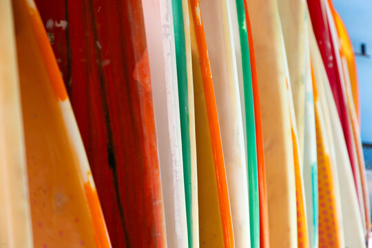 abstract of colorful surf boards stacked up