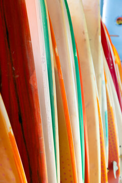 abstract of colorful surf boards stacked up