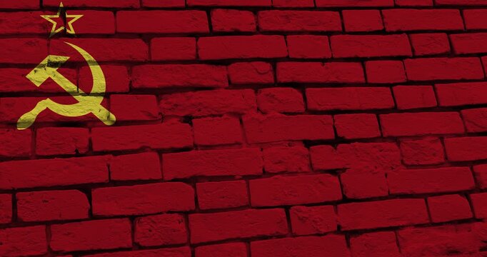 A panning video of a brick wall with the USSR Union of Soviet Socialist Republics flag